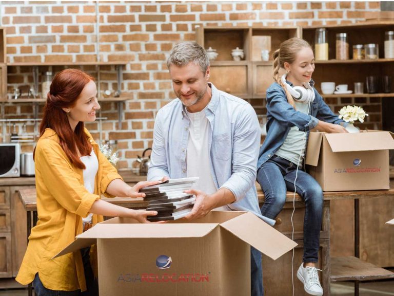 Happy parents with their daughter depacking their move after local relocation