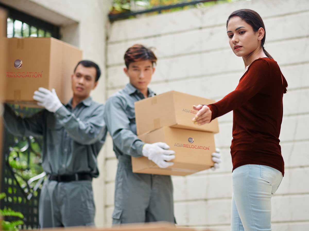 Moving Services in Vietnam | Local, International & Office Moving 9 Local moving crew loading a household in Vietnam