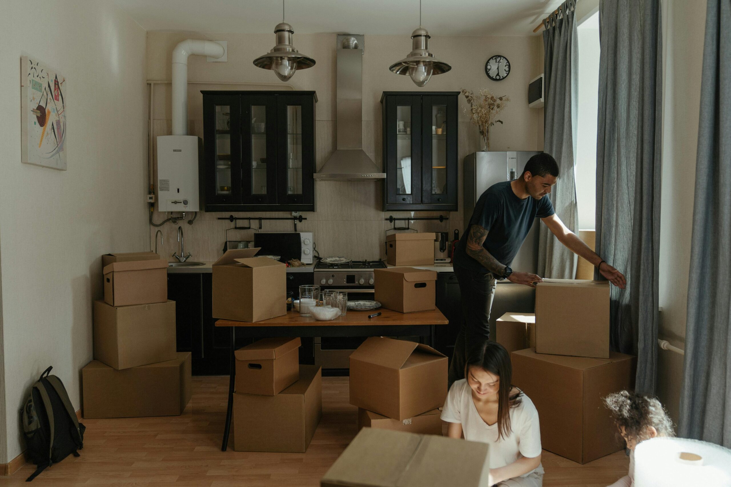 couple packing before moving from Vietnam to France